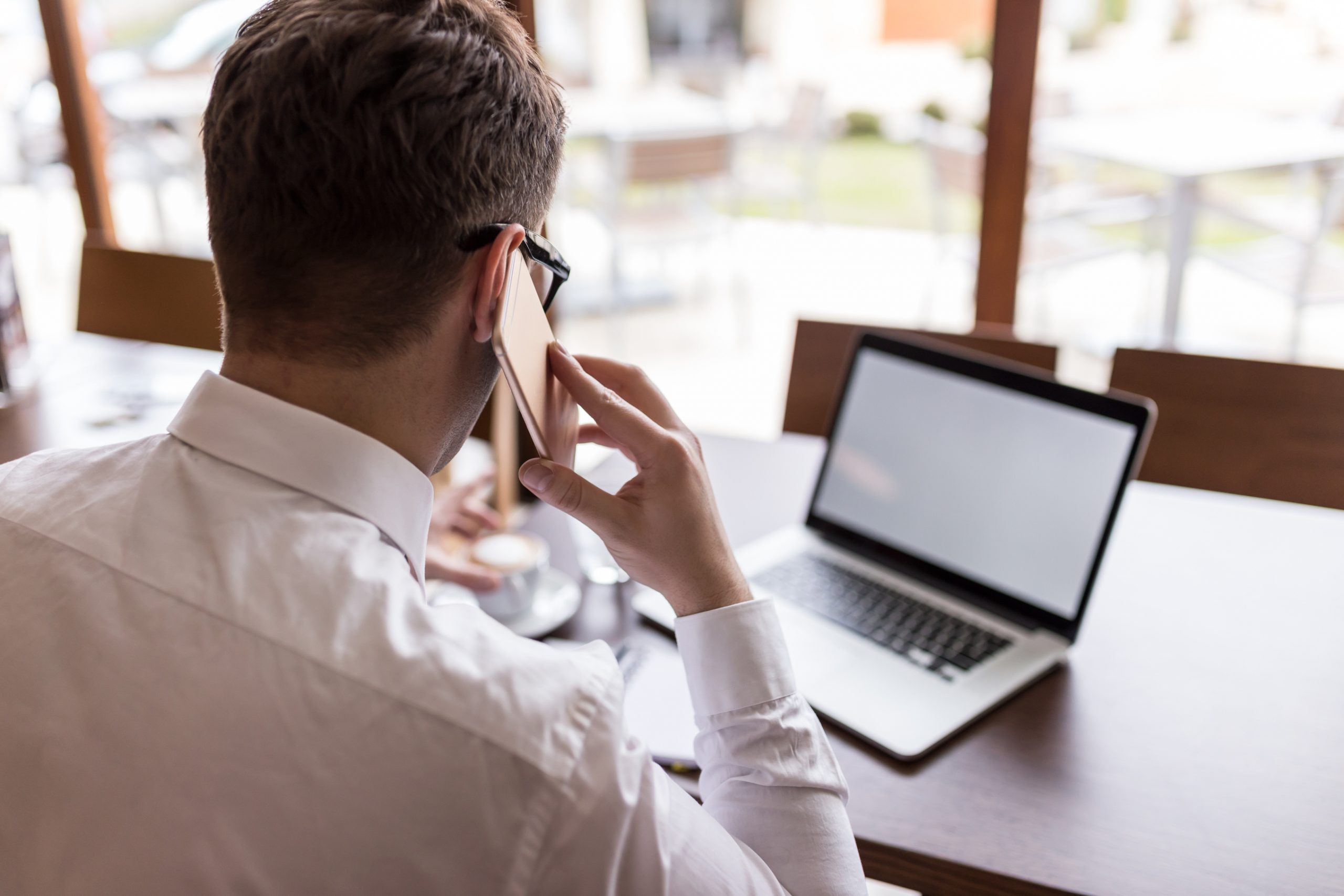 businessman using smartphone and laptop